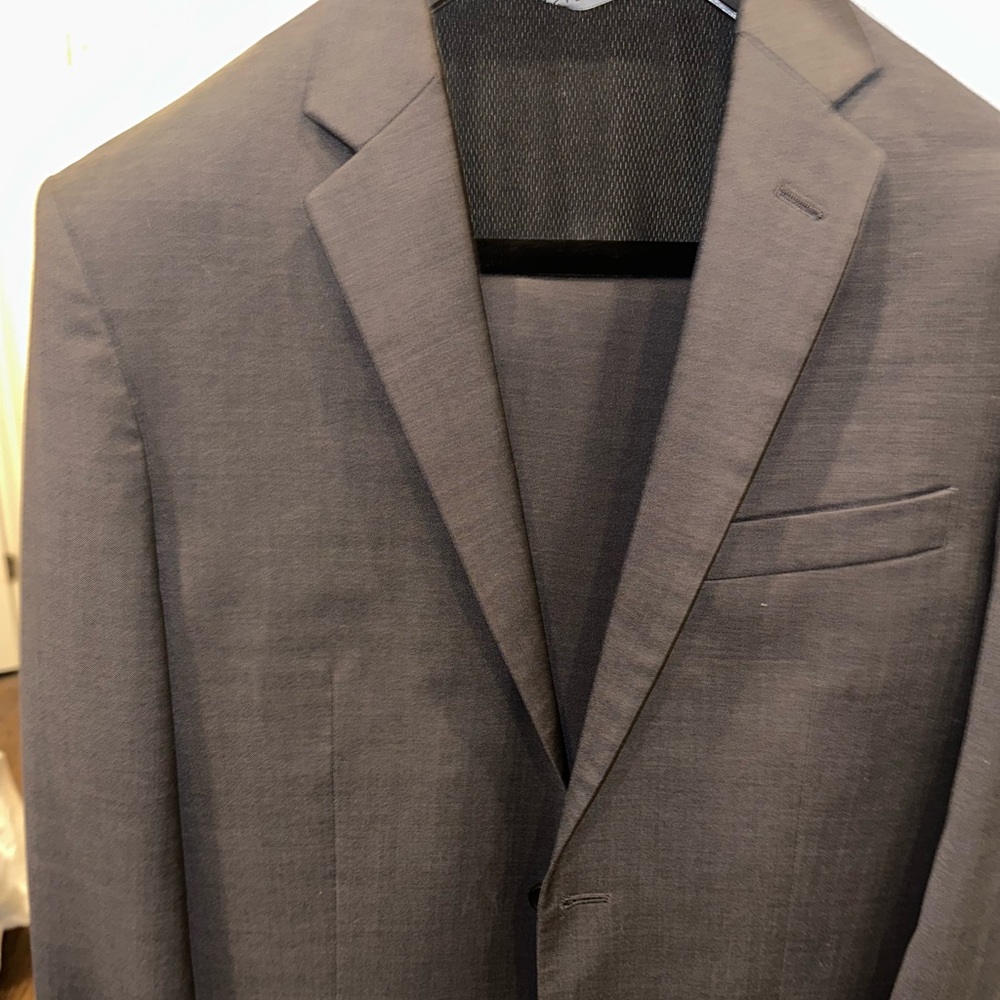Great charcoal suit. Dry cleaned after every 5 wears. Can be tailored / adjusted
